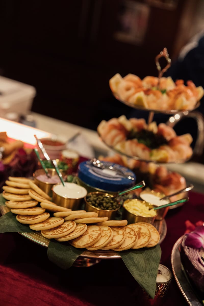 A caviar and blini spread with tiered shrimp towers